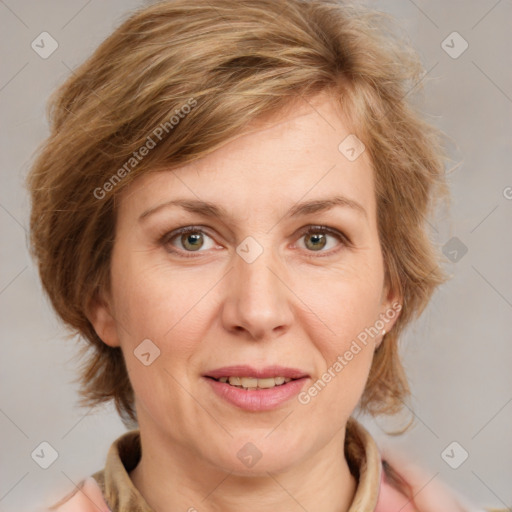 Joyful white adult female with medium  brown hair and blue eyes