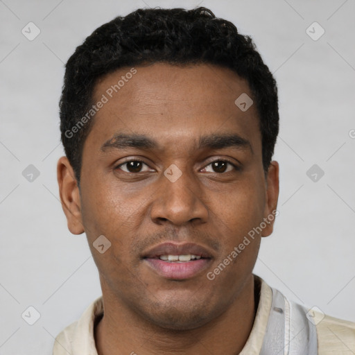 Joyful latino young-adult male with short  brown hair and brown eyes