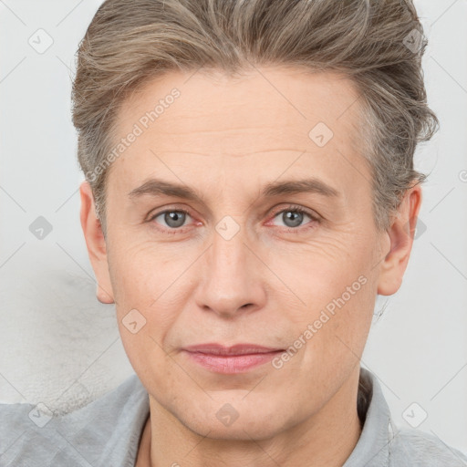 Joyful white adult male with short  brown hair and grey eyes