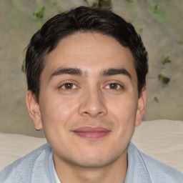 Joyful white young-adult male with short  black hair and brown eyes