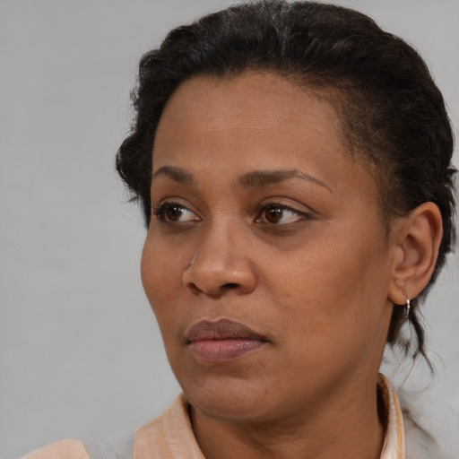 Neutral black adult female with short  brown hair and brown eyes