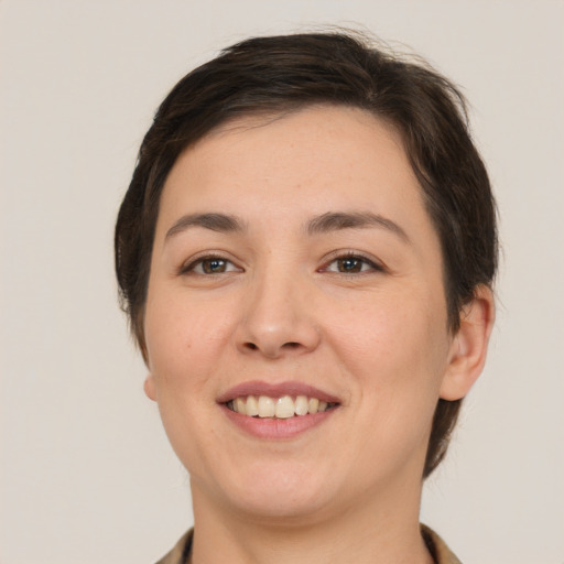 Joyful white young-adult female with medium  brown hair and brown eyes