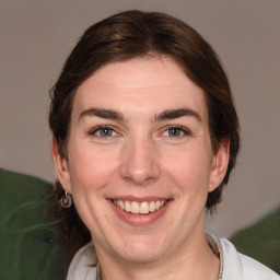 Joyful white adult female with medium  brown hair and brown eyes