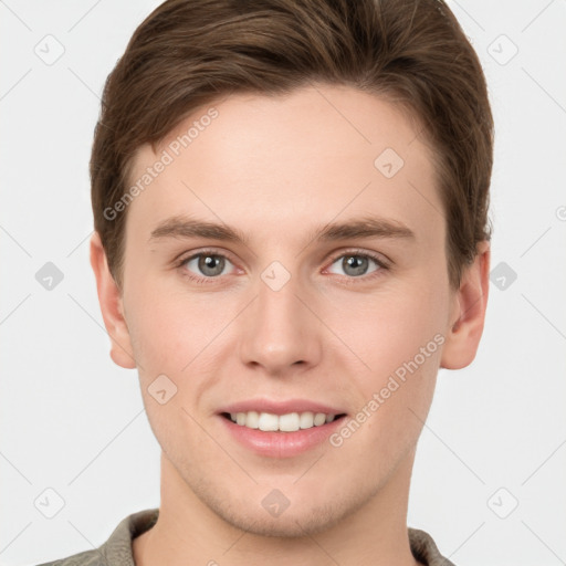 Joyful white young-adult male with short  brown hair and grey eyes