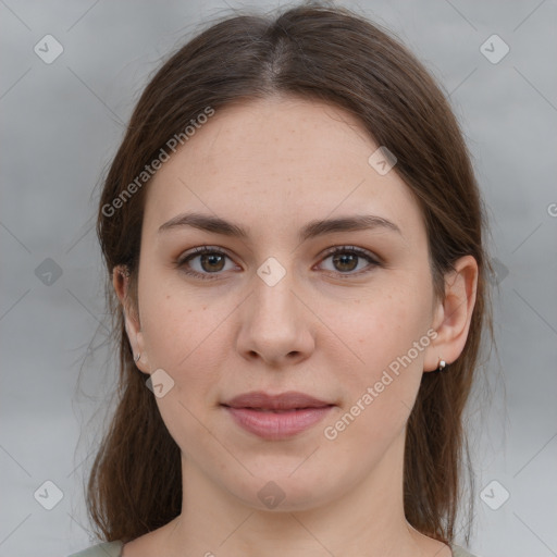 Joyful white young-adult female with medium  brown hair and grey eyes