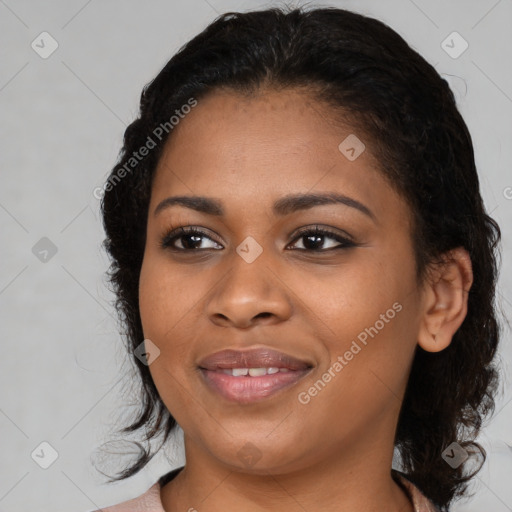 Joyful black young-adult female with medium  black hair and brown eyes