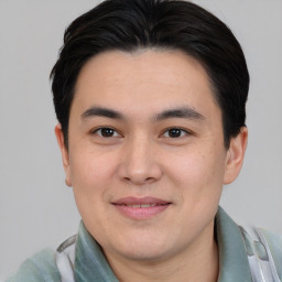 Joyful asian young-adult male with short  brown hair and brown eyes