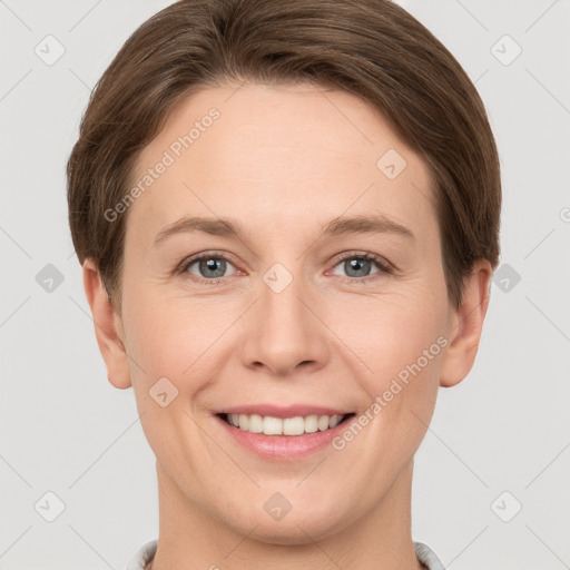 Joyful white young-adult female with short  brown hair and grey eyes