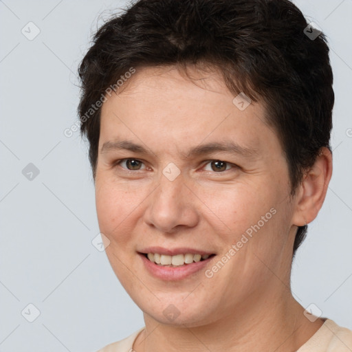 Joyful white adult female with short  brown hair and brown eyes