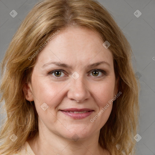 Joyful white adult female with medium  brown hair and green eyes