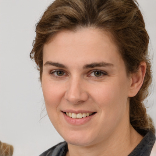 Joyful white young-adult female with medium  brown hair and brown eyes