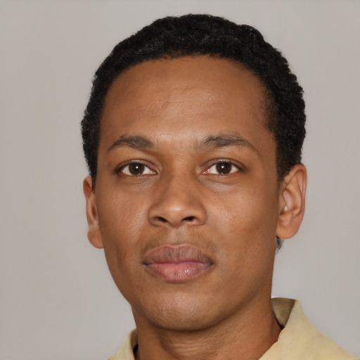 Neutral black young-adult male with short  black hair and brown eyes