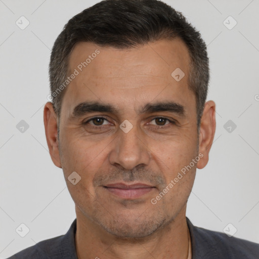 Joyful white adult male with short  brown hair and brown eyes