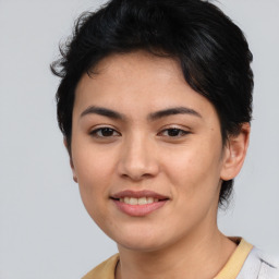 Joyful asian young-adult female with short  brown hair and brown eyes