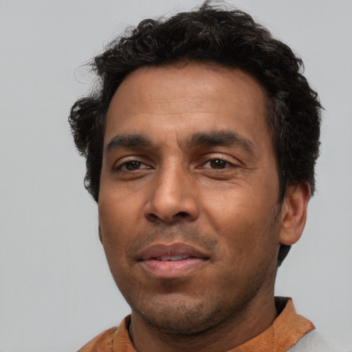 Neutral latino adult male with short  black hair and brown eyes