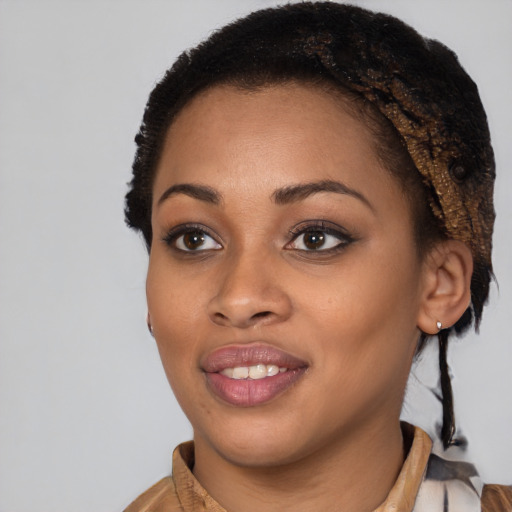 Joyful black young-adult female with short  brown hair and brown eyes