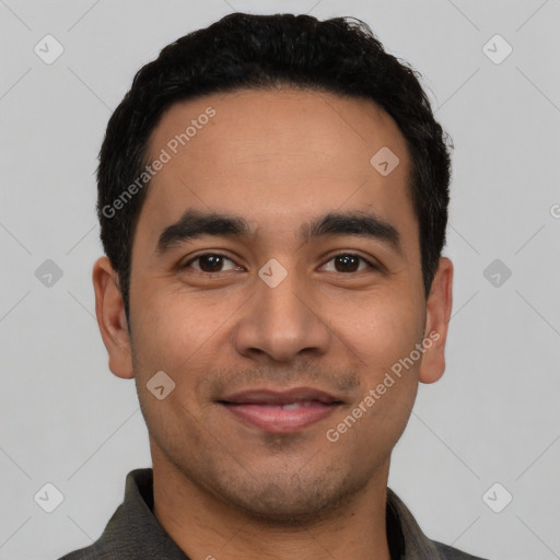 Joyful latino young-adult male with short  black hair and brown eyes