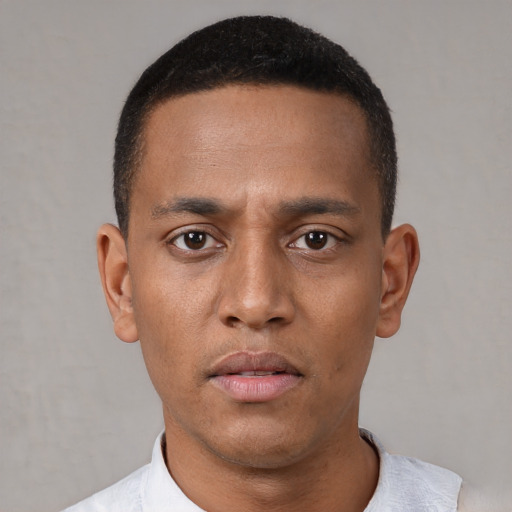 Neutral white young-adult male with short  black hair and brown eyes