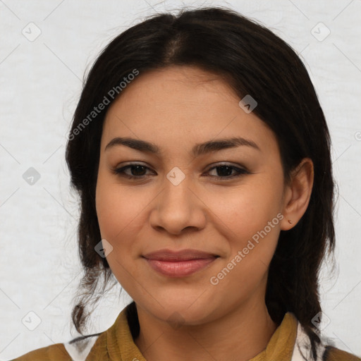 Joyful latino young-adult female with medium  brown hair and brown eyes