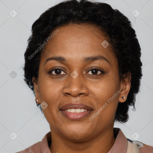 Joyful latino adult female with short  brown hair and brown eyes