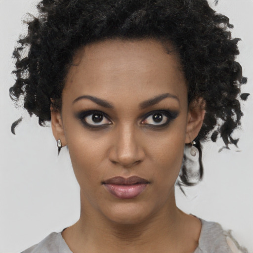 Neutral black young-adult female with short  black hair and brown eyes