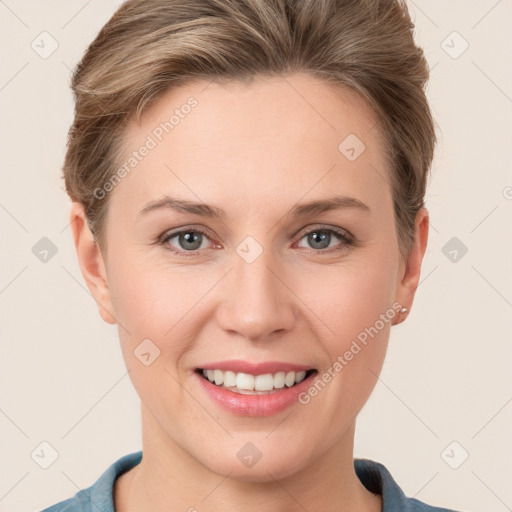 Joyful white young-adult female with short  brown hair and grey eyes