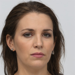 Neutral white young-adult female with long  brown hair and grey eyes