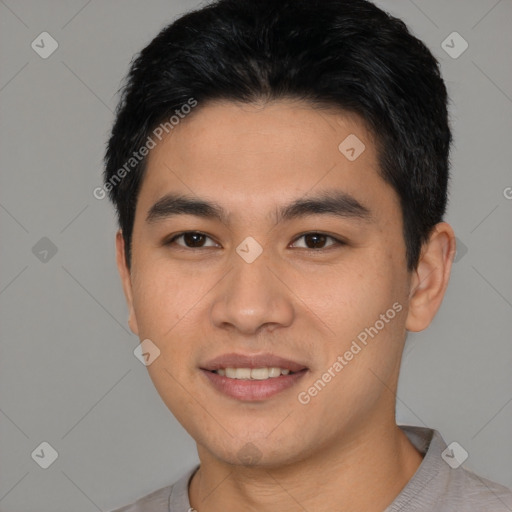 Joyful asian young-adult male with short  black hair and brown eyes