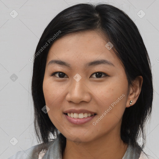 Joyful asian young-adult female with medium  black hair and brown eyes