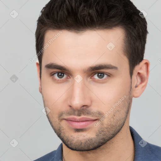 Neutral white young-adult male with short  brown hair and brown eyes