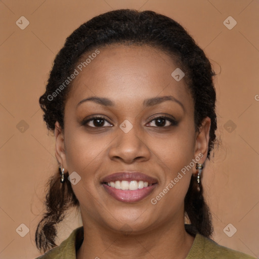 Joyful black young-adult female with medium  brown hair and brown eyes