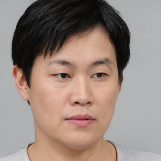Neutral asian young-adult male with short  brown hair and brown eyes