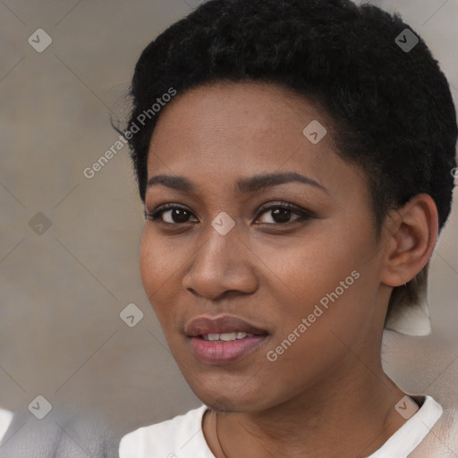 Joyful black young-adult female with short  black hair and brown eyes