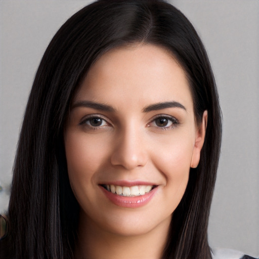 Joyful white young-adult female with long  black hair and brown eyes