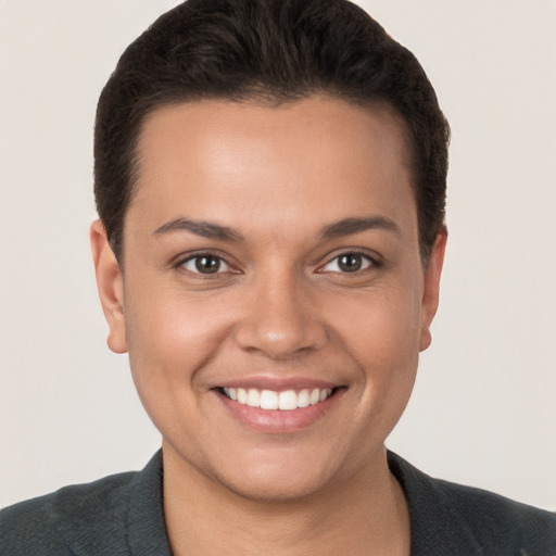 Joyful white young-adult female with short  brown hair and brown eyes