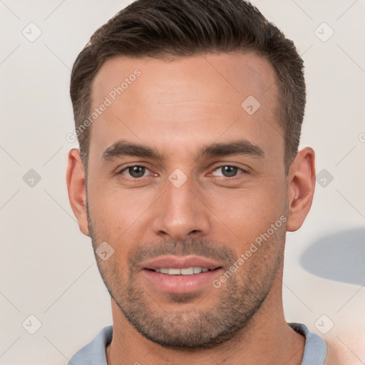 Joyful white young-adult male with short  brown hair and brown eyes