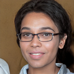 Joyful white young-adult female with medium  black hair and brown eyes