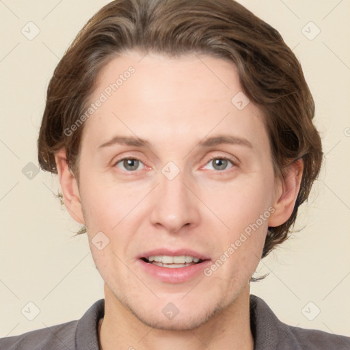 Joyful white adult male with short  brown hair and grey eyes