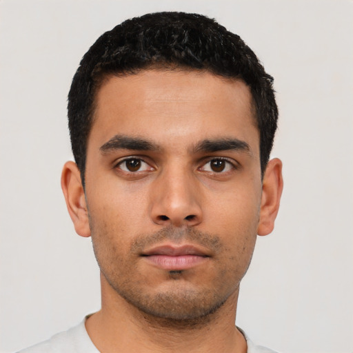 Neutral latino young-adult male with short  black hair and brown eyes