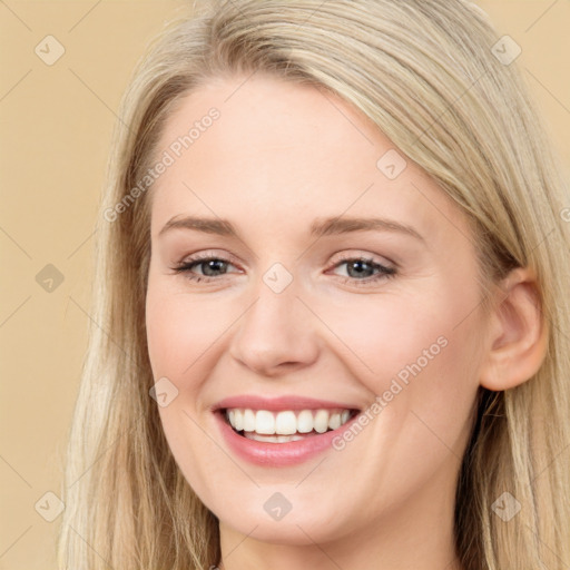 Joyful white young-adult female with long  brown hair and grey eyes