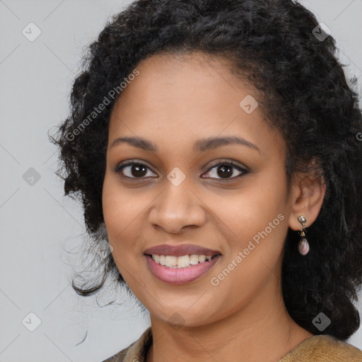 Joyful black young-adult female with long  black hair and brown eyes