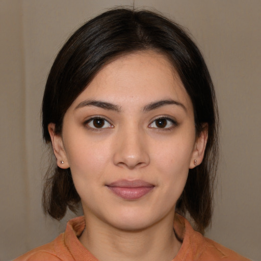 Joyful white young-adult female with medium  brown hair and brown eyes