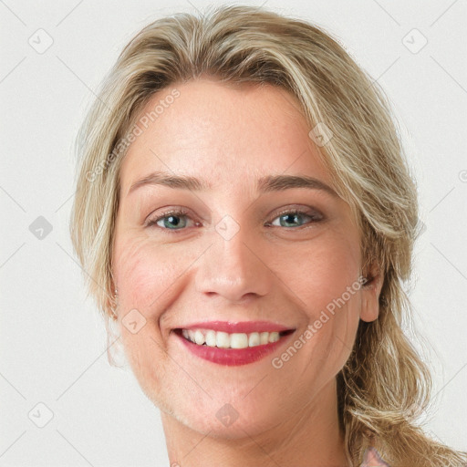 Joyful white young-adult female with long  brown hair and blue eyes