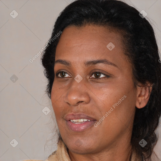 Joyful black adult female with medium  brown hair and brown eyes