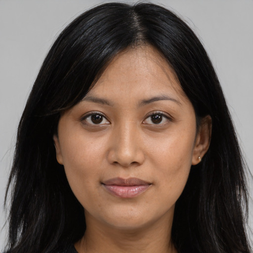 Joyful asian young-adult female with long  black hair and brown eyes