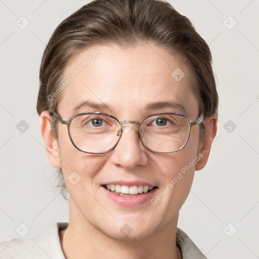 Joyful white adult female with short  brown hair and grey eyes