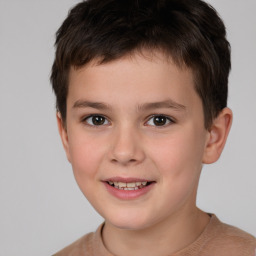 Joyful white child male with short  brown hair and brown eyes