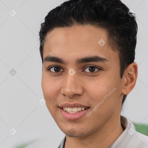 Joyful white young-adult male with short  black hair and brown eyes