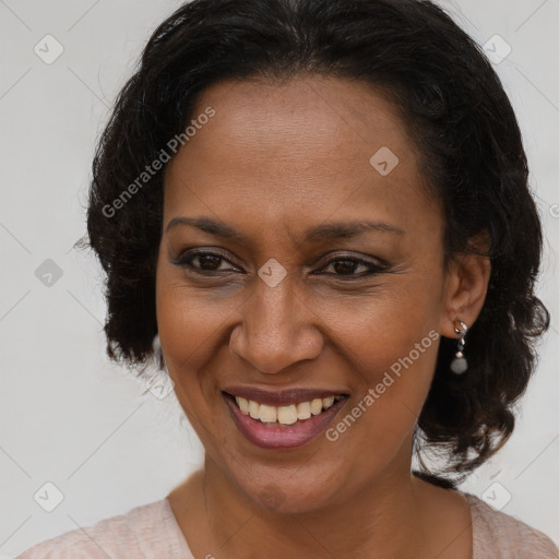 Joyful black adult female with medium  brown hair and brown eyes