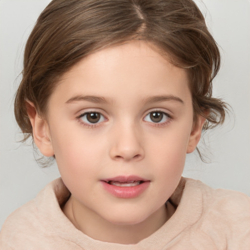 Joyful white child female with medium  brown hair and brown eyes